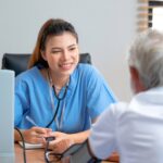 Doctor checking blood pressure of an elderly patient during a diabetes health checkup