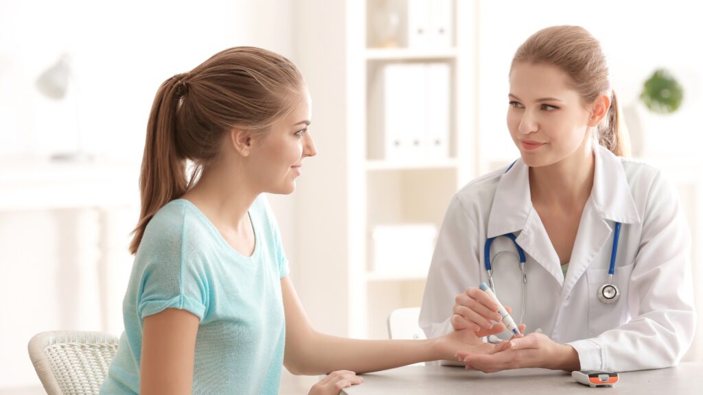 Doctor testing blood sugar levels of a diabetes patient for effective diabetes management and treatment.