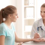 Doctor testing blood sugar levels of a diabetes patient for effective diabetes management and treatment.