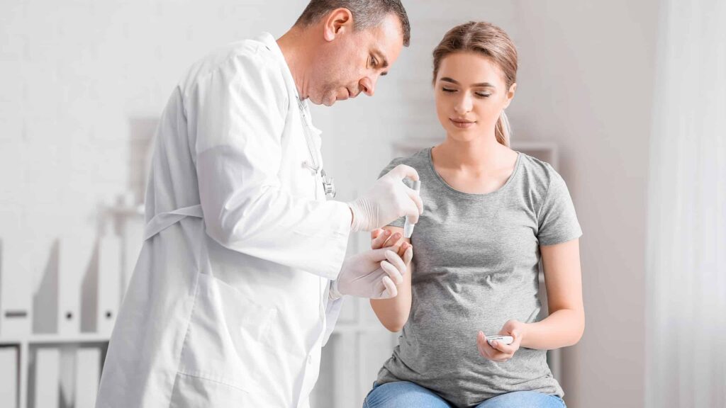 Diabetes specialist checking blood sugar and guiding treatment.