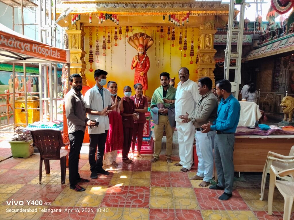 Doctors conducting free diabetes checkup and blood sugar screening at health camp