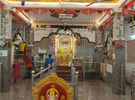 Diabetes health awareness camp setup inside temple with decorated interior
